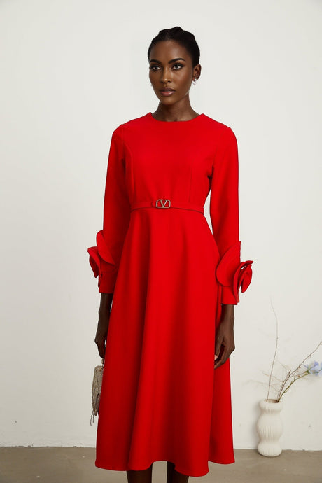 Woman wearing a red long sleeve dress with floral pattern