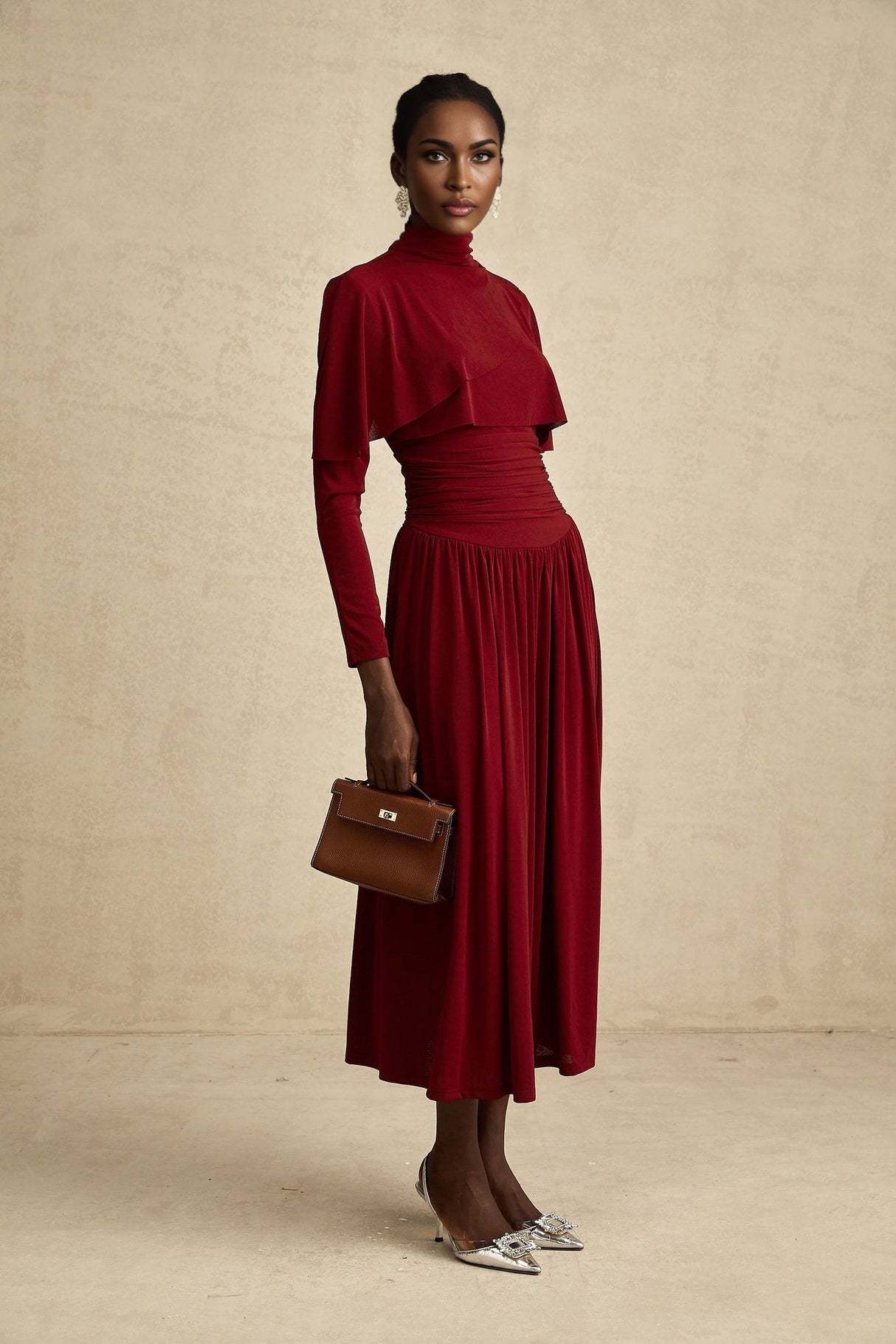 Woman wearing a red midi dress with ruched detailing and a flap design on the bodice