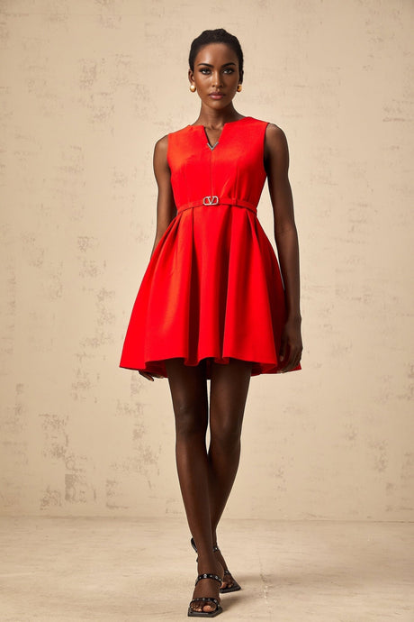 Woman wearing a red mini dress with split neckline and cinched waist