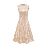 Woman wearing a shimmering midi dress adorned with faux pearls and sequins