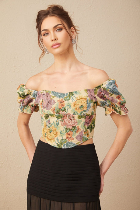 Woman wearing a short cropped top with floral print pattern in jacquard fabric