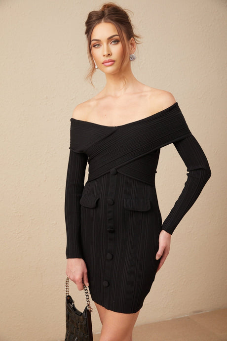 Woman wearing a short off shoulder dress with ribbed knit texture in light color