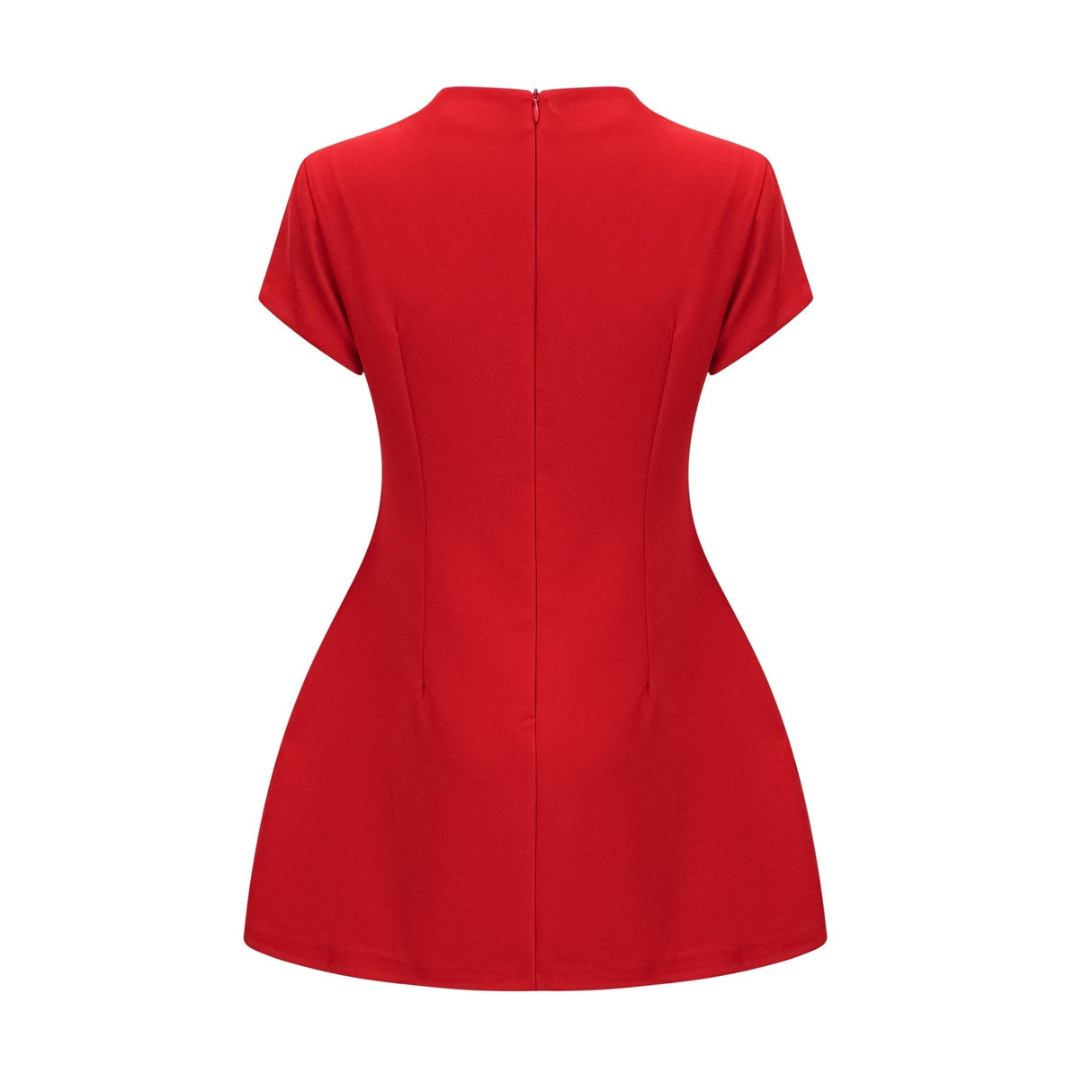 Woman wearing a short red dress with cap sleeves standing against a plain background