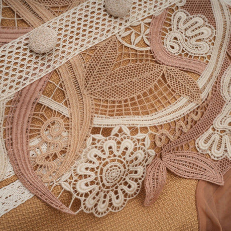 Woman wearing a short white lace dress with peplum waist and cutout details