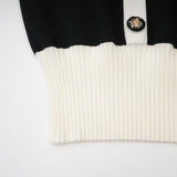 Woman wearing a short wool dress with colorblocked design and ribbed knit texture in contrasting colors