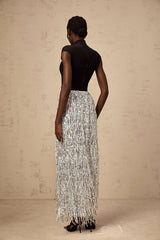 Woman wearing a twotone matching set consisting of a corsetstyle top and skirt in the Virginie style