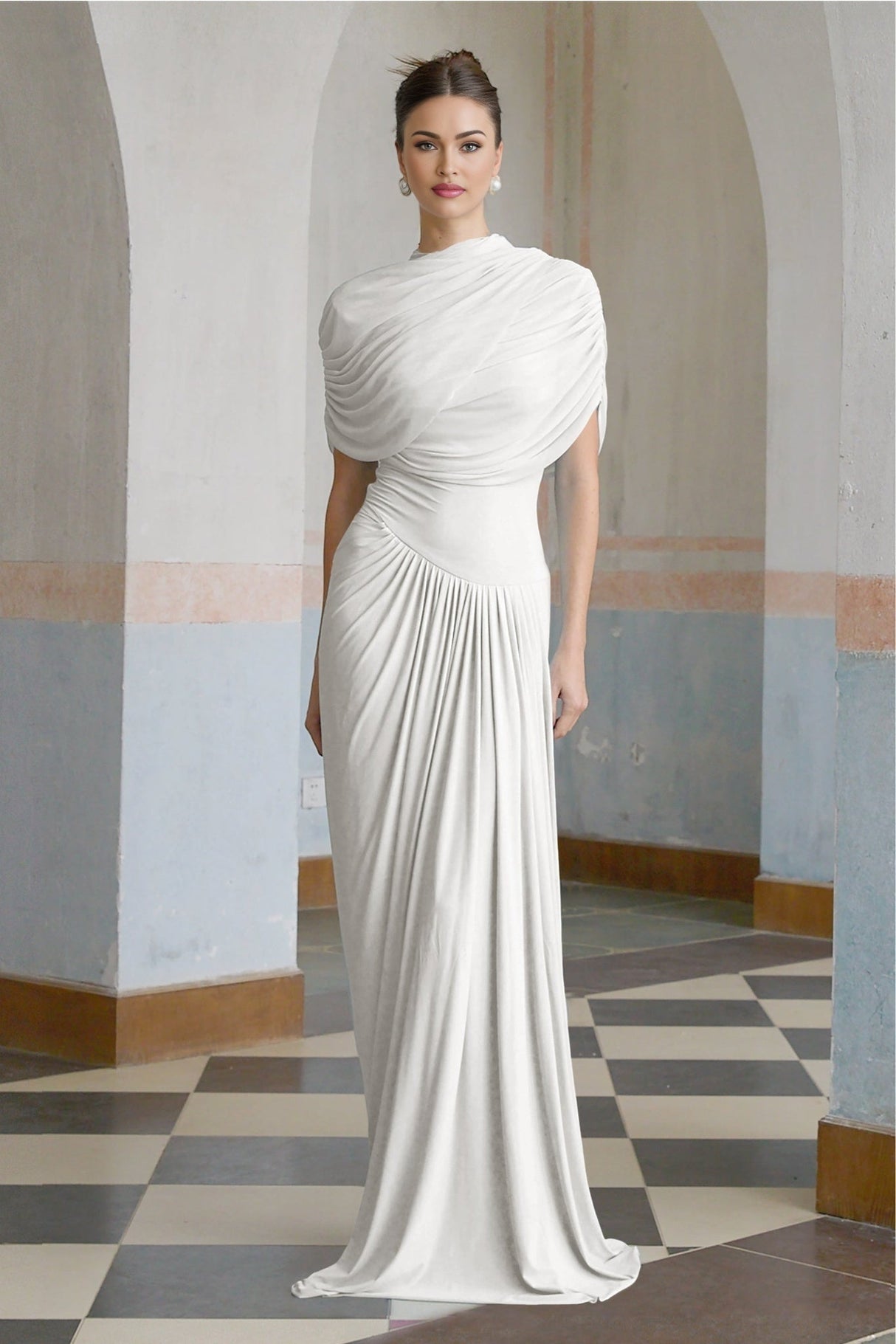 Woman wearing a white asymmetric pleated maxi dress with flowing fabric and elegant design