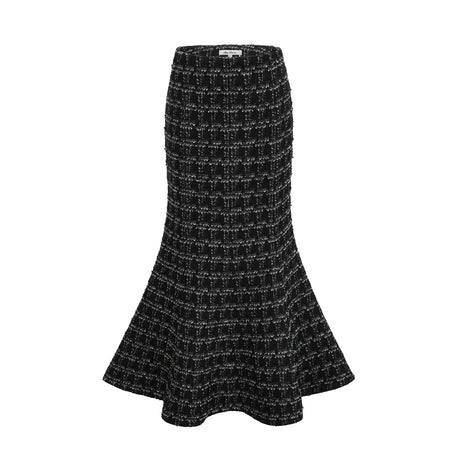 Woman wearing black and white checked tweed vest top and matching skirt set called Axelle