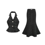 Woman wearing black and white checked tweed vest top and matching skirt set named Axelle