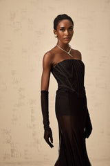 Woman wearing black floral lace corset skirt and gloves matching set Violaine style