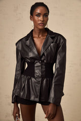 Woman wearing black leather jacket with panelled design front view