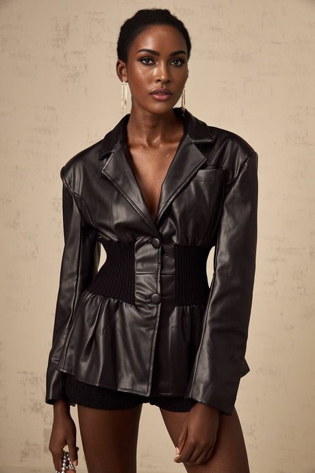 Woman wearing black leather jacket with panelled design front view
