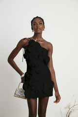 Woman wearing black offshoulder mini dress with floral pattern