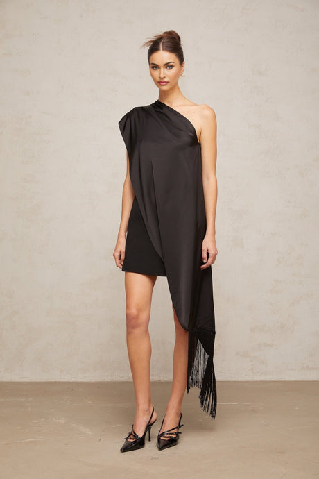 Woman wearing black one shoulder mini dress for Valentines Day occasion
