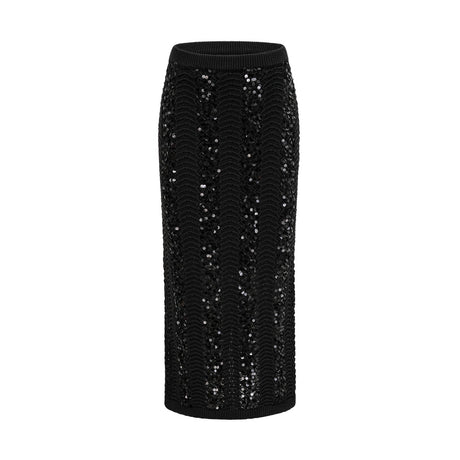 Woman wearing black sequined crochet knit cardigan and matching skirt set