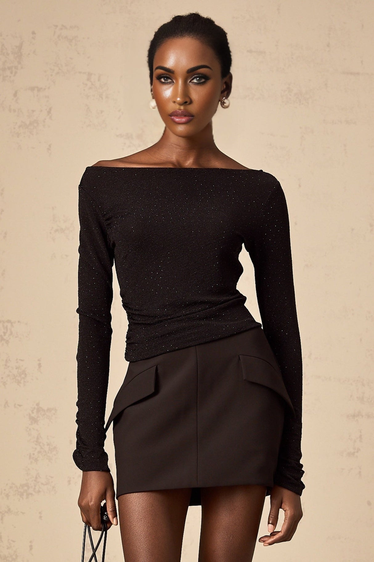 Woman wearing black sequined matching set with top and skirt Berenice design
