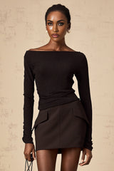 Woman wearing black sequined matching set with top and skirt Berenice design
