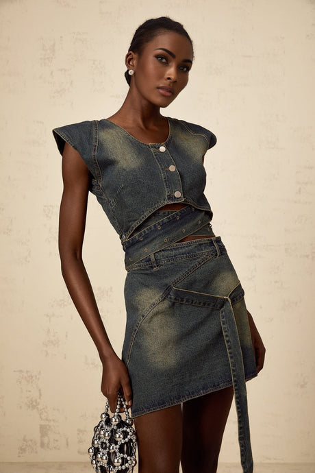 Woman wearing blue denim crossover top with matching denim skirt in fanny pack style set