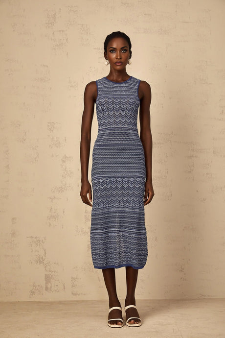 Woman wearing blue midi dress with wavy crochet knit pattern