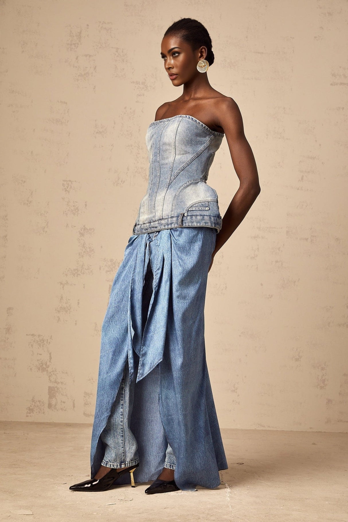 Woman wearing blue off shoulder denim top with relaxed fit