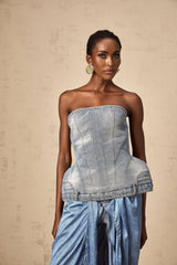 Woman wearing blue off shoulder denim top with short sleeves and relaxed fit