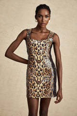 Woman wearing brown leopard print mini dress with lace details and sequin embellishments short sleeves form fitting silhouette