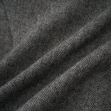 Woman wearing grey herringbone pattern matching top and shorts set
