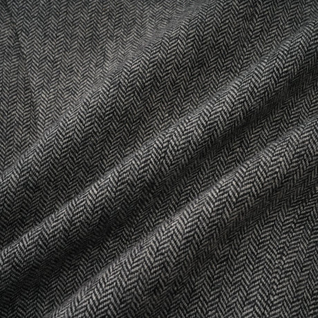 Woman wearing grey herringbone pattern matching top and shorts set