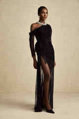 Woman wearing long black one shoulder maxi dress with cutout detail