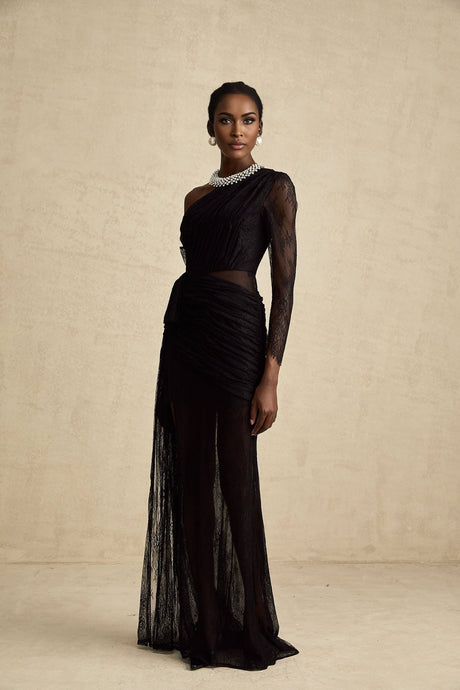 Woman wearing long black one shoulder maxi dress with side cutout detail