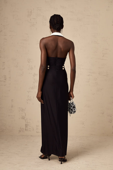 Woman wearing long fitted maxi dress with color block design in contrasting shades