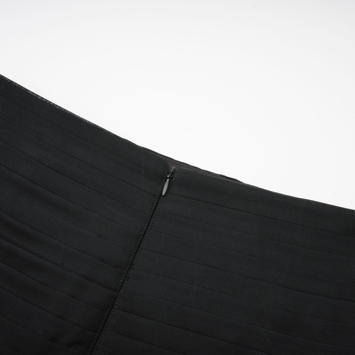 Woman wearing long flowy maxi skirt with ruffles and pleats in soft tulle fabric