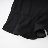 Woman wearing long flowy maxi skirt with ruffles and pleats in soft tulle fabric