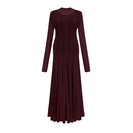 Woman wearing long red lace maxi dress with wavy pattern and flowing silhouette