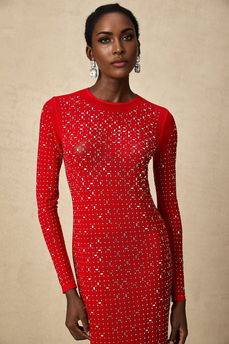 Woman wearing long red maxi dress with tulle skirt and rhinestone embellishments