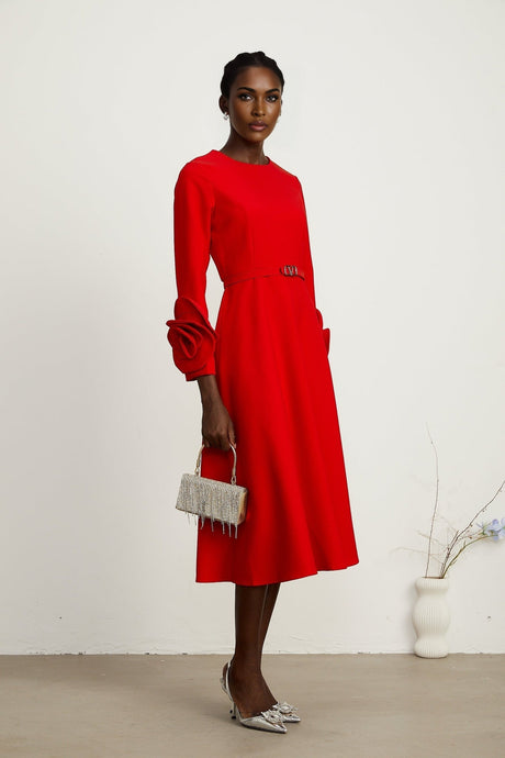Woman wearing long sleeve red dress with floral pattern
