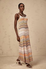 Woman wearing long striped knit maxi dress in multiple colors by Chloe
