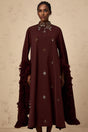 Woman wearing purple sequined midi dress with flared sleeves