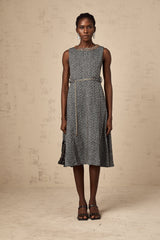 Woman wearing sleeveless grey tweed midi dress with crystal embellishments for Valentines Day occasion
