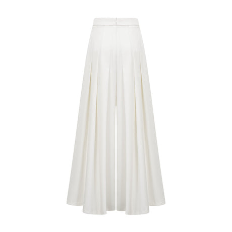 Woman wearing white creased top and matching trousers set Adele style outfit
