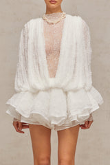 Woman wearing white lace matching set including top shorts and dress semi sheer fabric floral lace pattern delicate feminine design