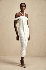 Woman wearing white midi dress with braided rope details and sleeveless design