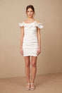 Woman wearing white off shoulder mini dress with ruffled details