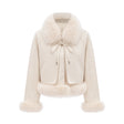Woman wearing white suede short coat with fur trim and padded design
