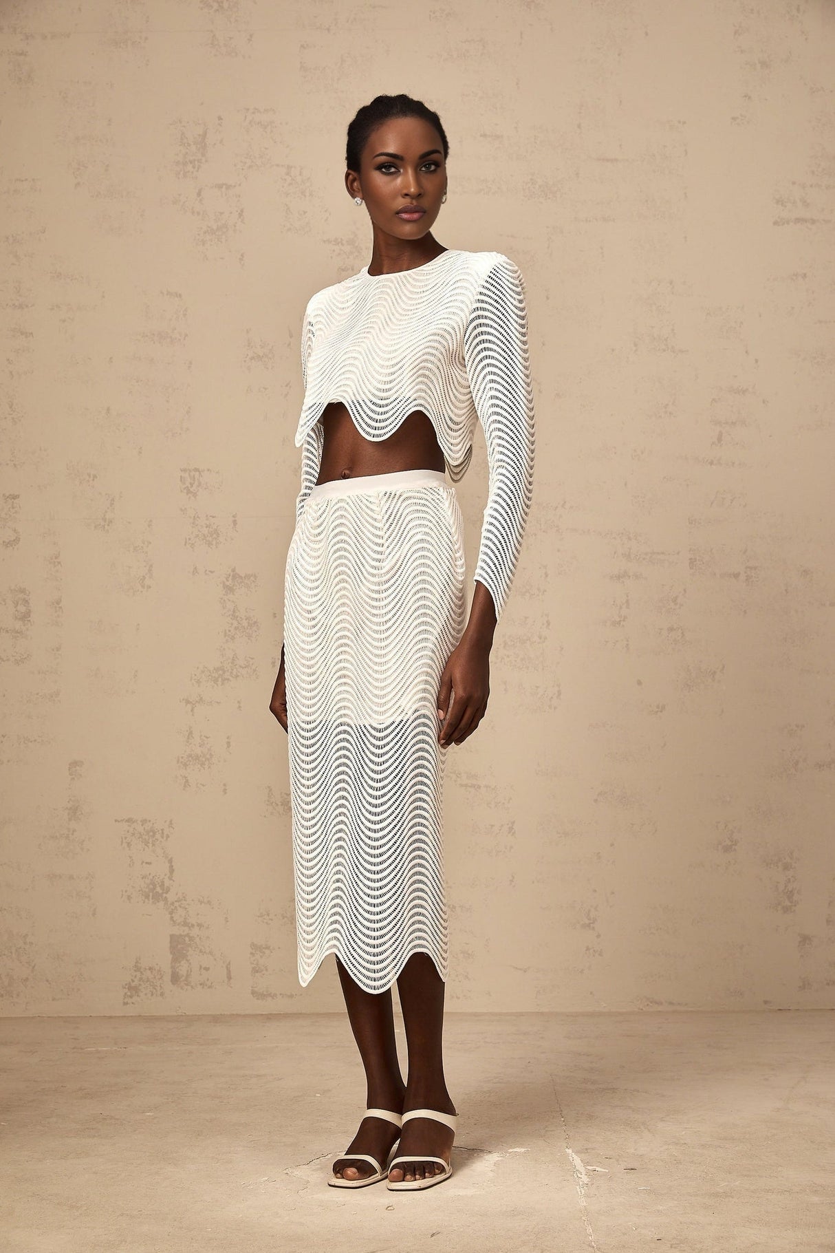 Woman wearing white wavy woven matching top and skirt set named Constance