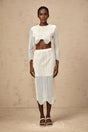 Woman wearing white wavy woven top and matching skirt set called Constance