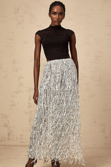 Womans two piece outfit featuring a black and white corset style top with matching skirt