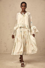 Womens matching set featuring a floral print blouse with ruffles and a coordinating dress in the same pattern