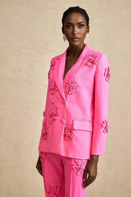 Young girl wearing pink floral jacket and matching trousers set named AmelieRose