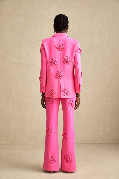 Young girl wearing pink floral jacket and matching trousers set named AmelieRose